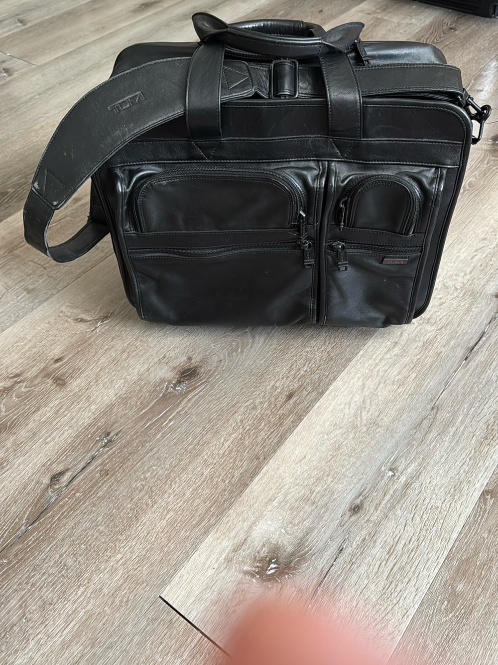 Tumi Black Leather Rolling Laptop Briefcase with Front Zip Pockets